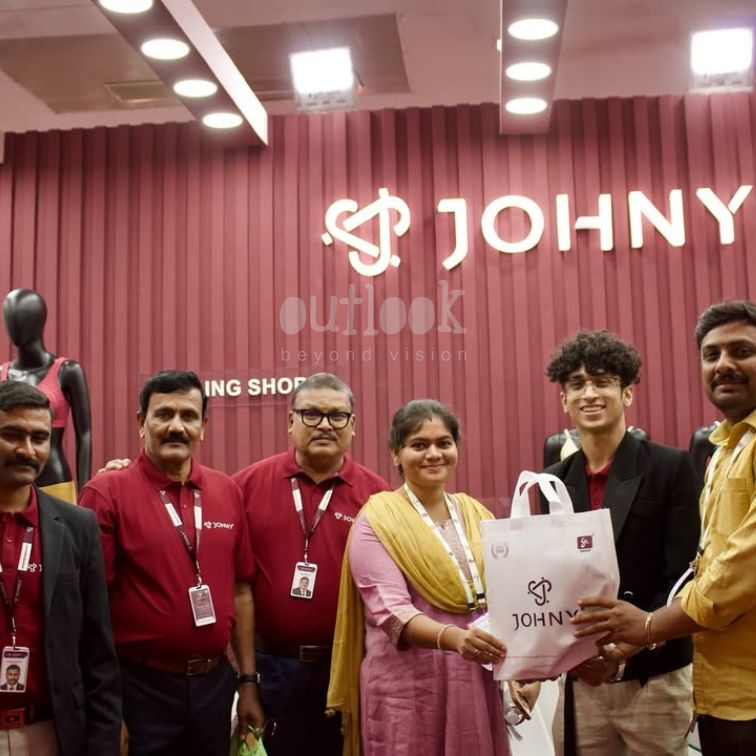 JOHNY team engaging with customers at exhibition stall